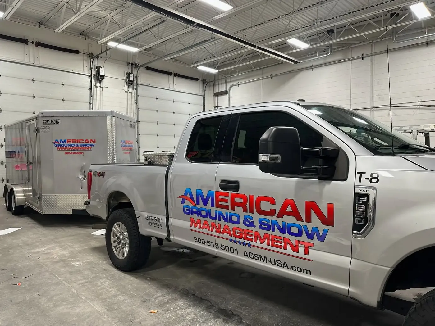 American Ground & Snow Management branded truck and trailer