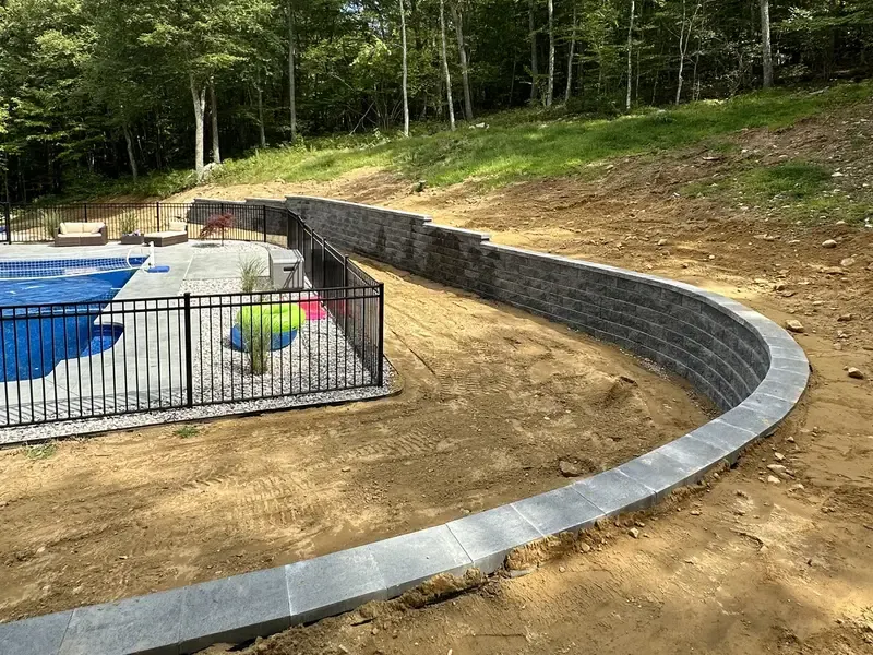 High Vibe Gardens retaining wall beside a pool in Connecticut