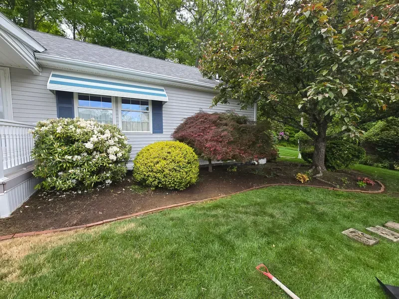 High Vibe Gardens shrub beds and edging at a Connecticut home