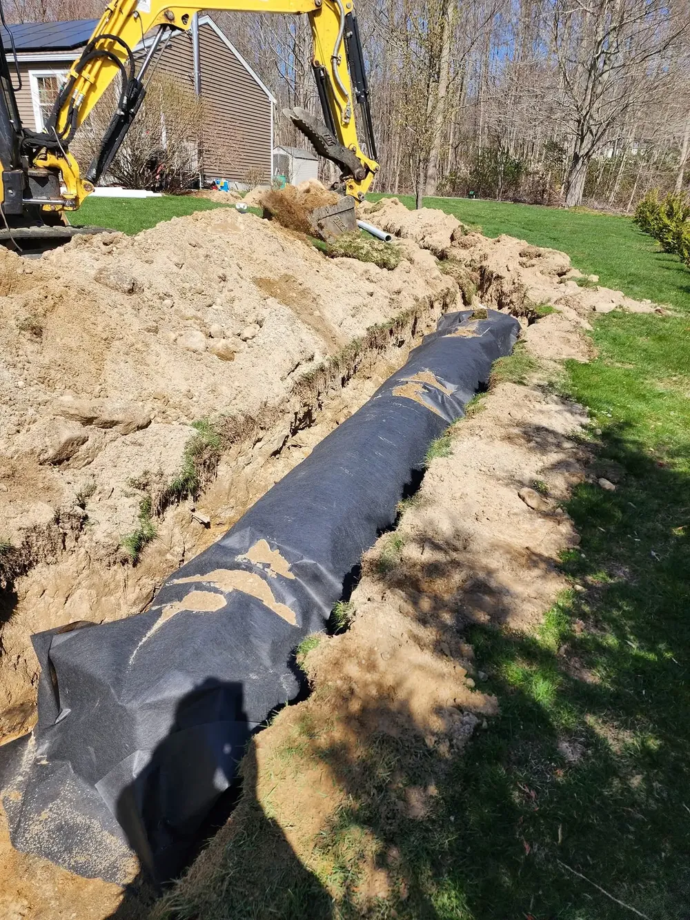 Sparkle Lake Services installing a French drain in Connecticut