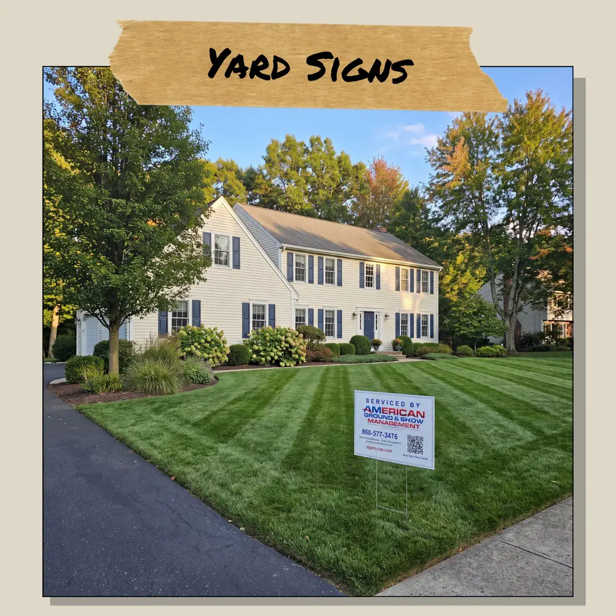 American Ground & Snow yard sign on a freshly striped lawn