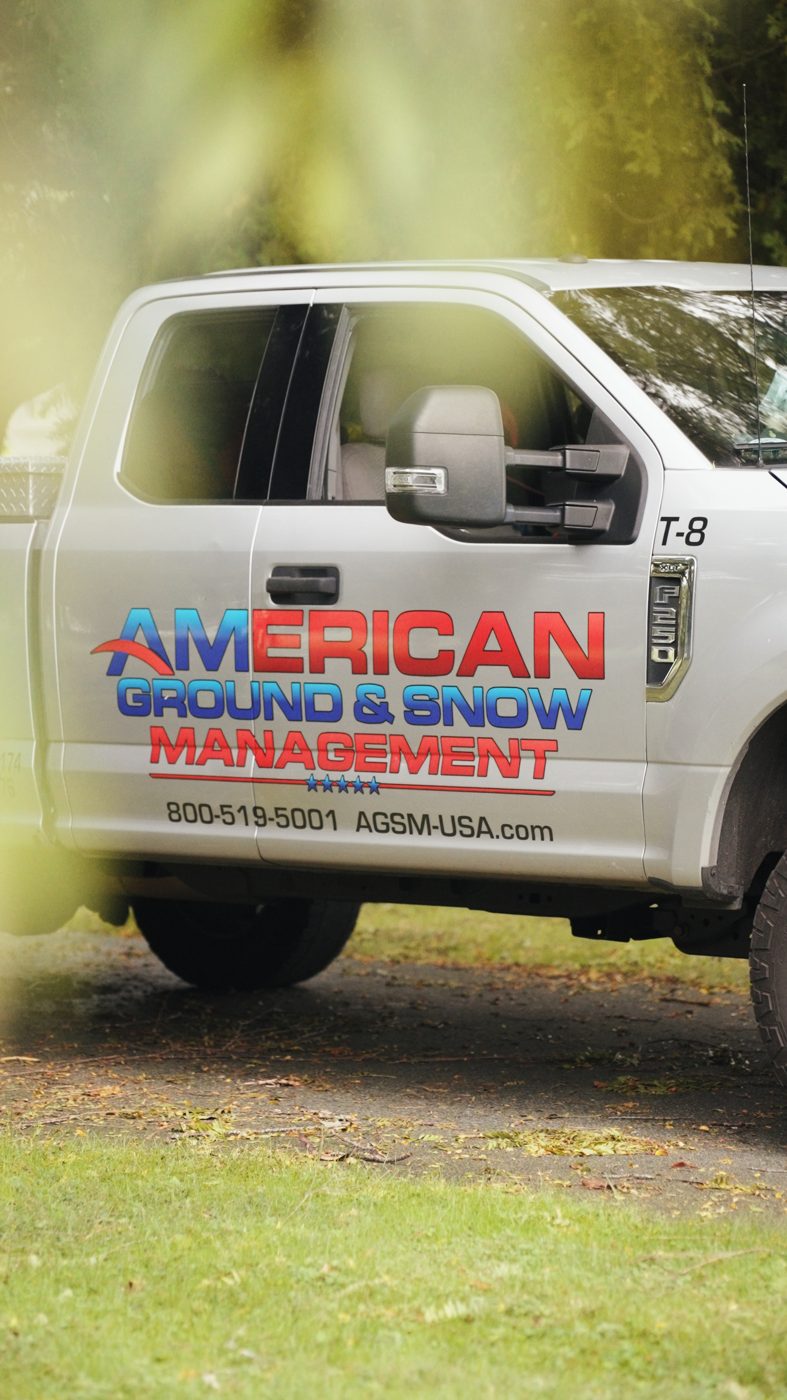 American Ground & Snow branded truck on a job
